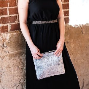 Faux fur clutch with detachable wristlet strap